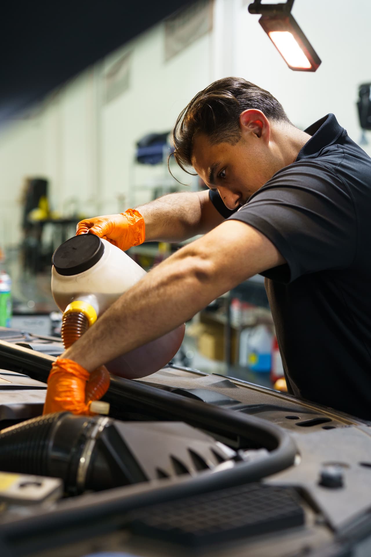 PC Automotive technician performing an oil service